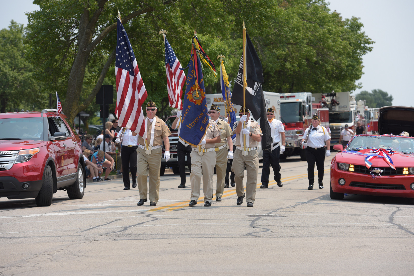 A diverse group of people walking together down a city street