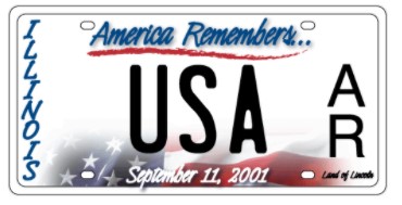 Aluminum license plate featuring the phrase America Remembers with a patriotic design.